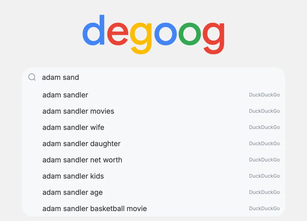 The home page search box with 'adam sand' typed. A list of suggestions starting with 'adam sandler' is open below it, with DuckDuckGo written on the right of each one.