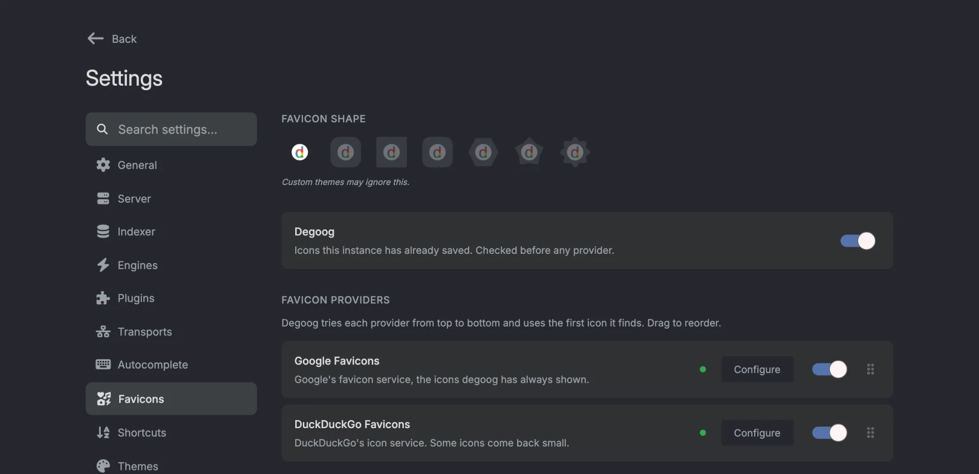 The Favicons tab. A row of seven favicon shapes with the note 'Custom themes may ignore this.' Below it a Degoog card that is switched on, then Google Favicons and DuckDuckGo Favicons, each with a Configure button, a switch and a drag handle.
