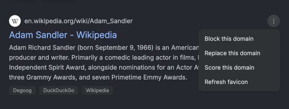 The three dots menu open on the Adam Sandler Wikipedia result, with Block this domain, Replace this domain, Score this domain and Refresh favicon.